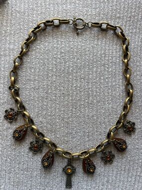 Vintage bronze tone dangly orange rhinestone embedded cross on chain necklace